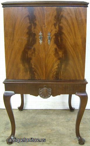 Antique Flame Mahogany Queen Ann Cabinet